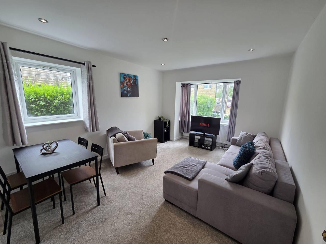 Bright living and dining area with sofas and a TV — Lynton Avenue 5a, Huddersfield